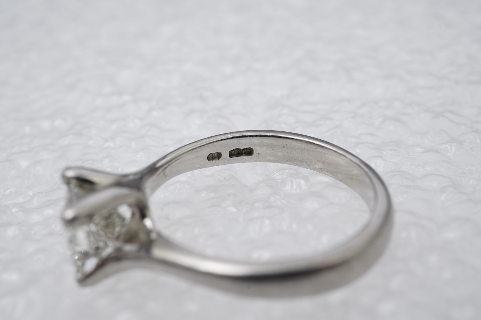 A diamond solitaire ring